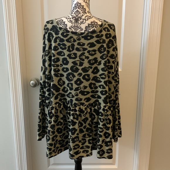 Woman’s long sleeve animal print babydoll top with rounded neckline. - Picture 6 of 8
